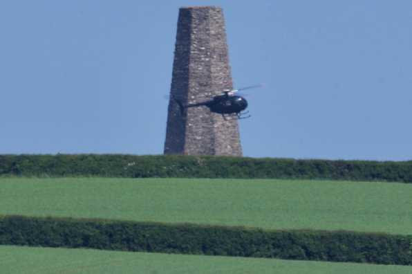 24 May 2020 - 15-28-23 
The Hughes helicopter (and its pilot) from AH Aviation arrives at the Daymark to begin its extraordinary effort to quell the Kingswear fire.
---------------------------
Helicopter G-BIOA tackles Kingswear fire